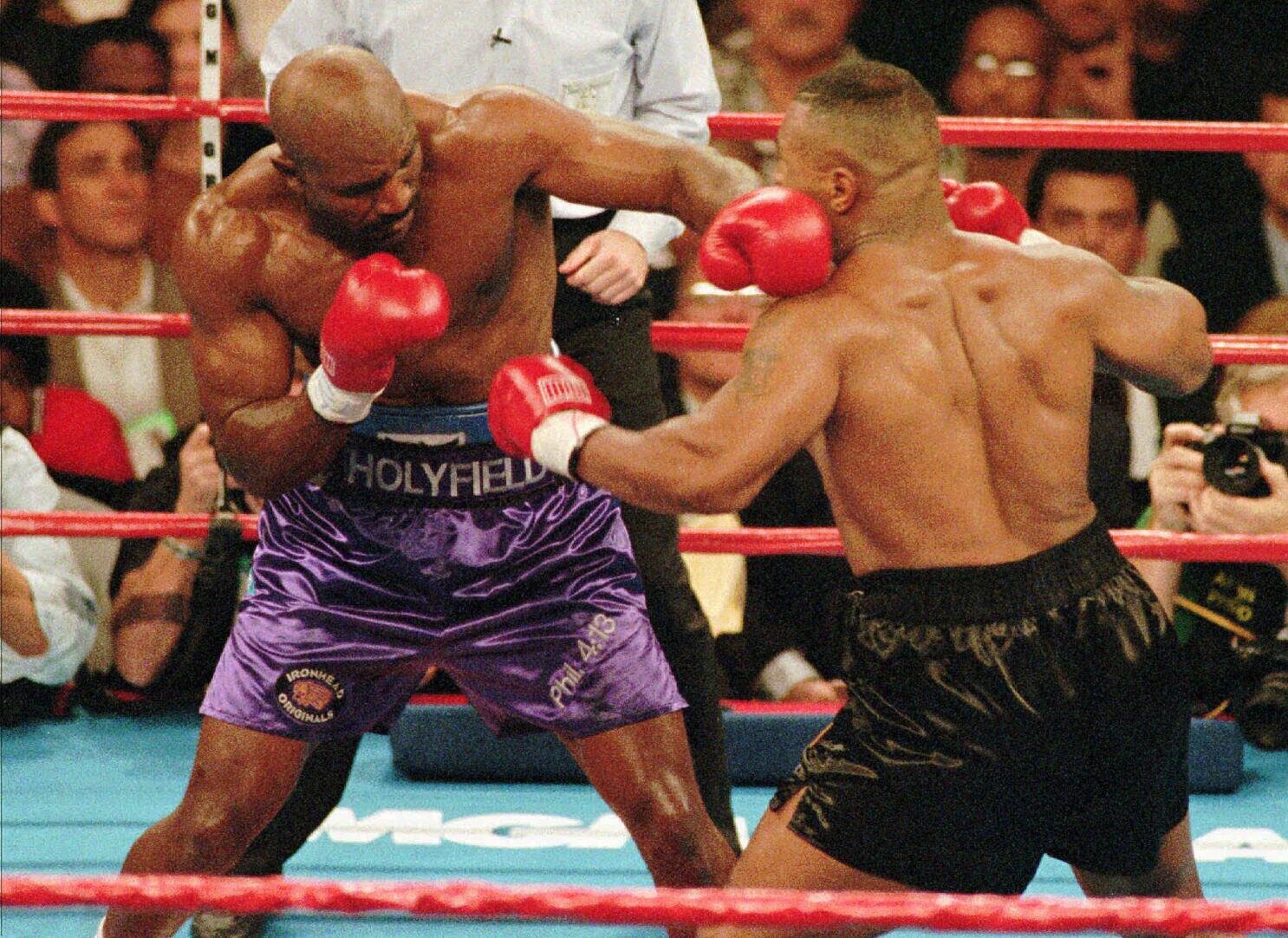 Evander-Holyfield-vs.-George-Foreman-Today in Sports History