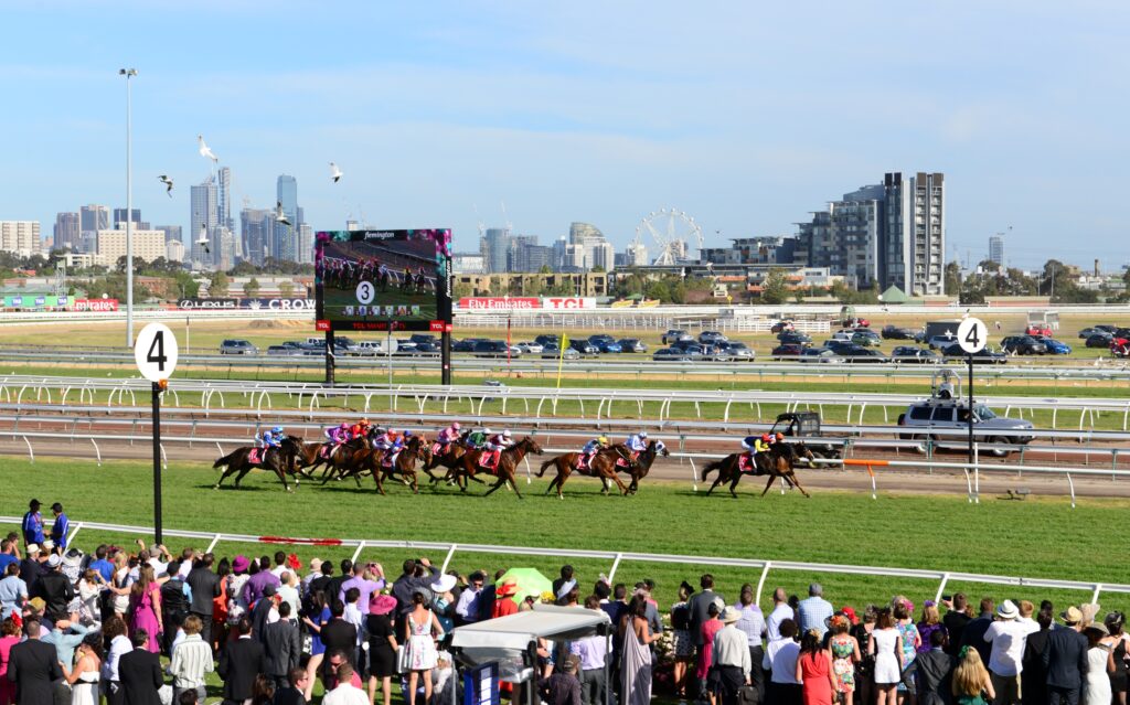 Horses racing at melbourne cup with crown